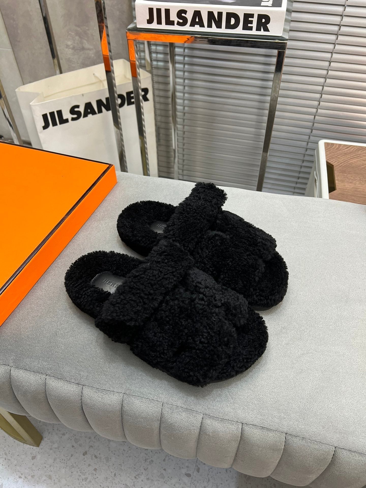 HERMES CHYPRE SLIPPERS IN BLACK LAMB WOOL