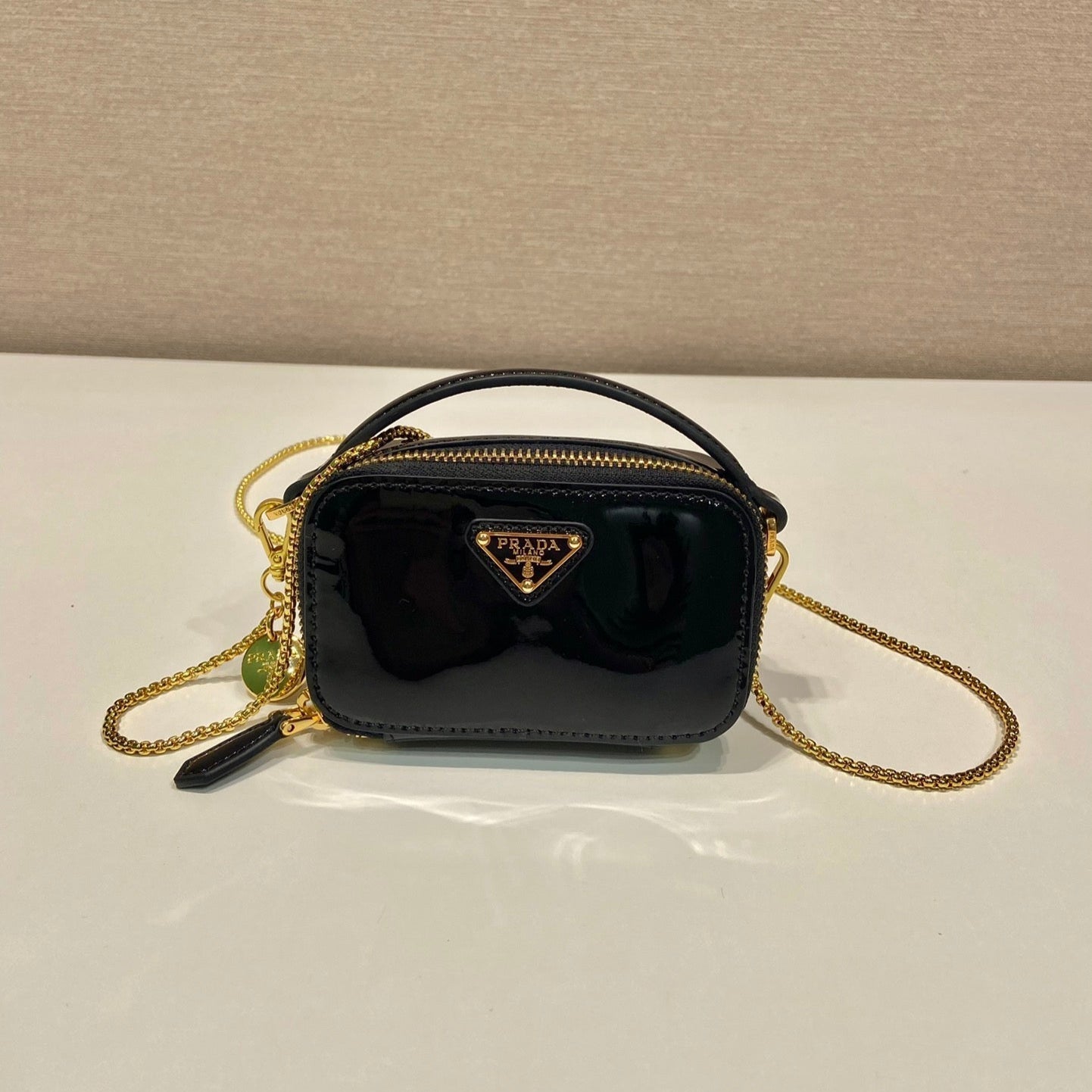 PRADA MINI HAND BAG 11 WITH GOLD STRAP IN BLACK PATENT CALFSKIN