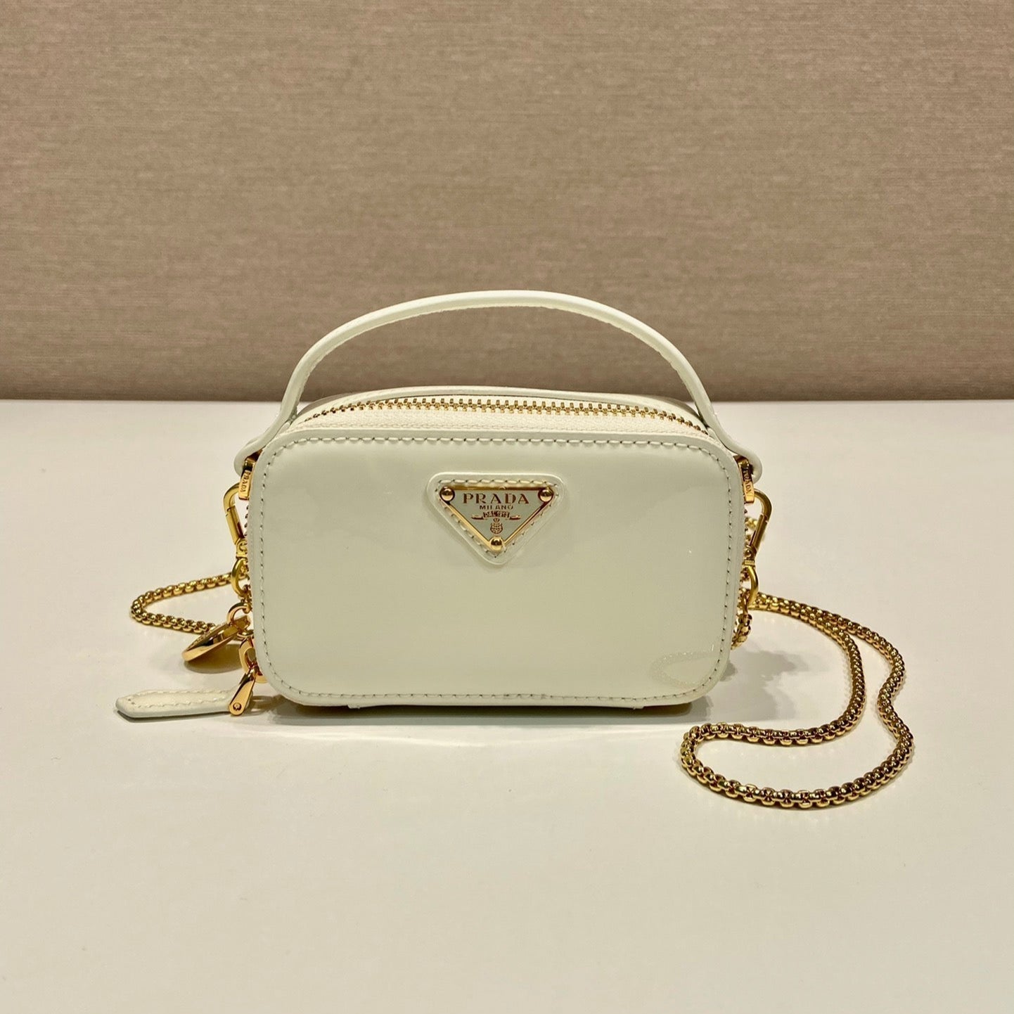 PRADA MINI HAND BAG 11 WITH GOLD STRAP IN WHITE PATENT CALFSKIN