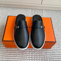 HERMES 25S MULES IN BLACK LAMBSKIN WITH SILVER HARDWARE