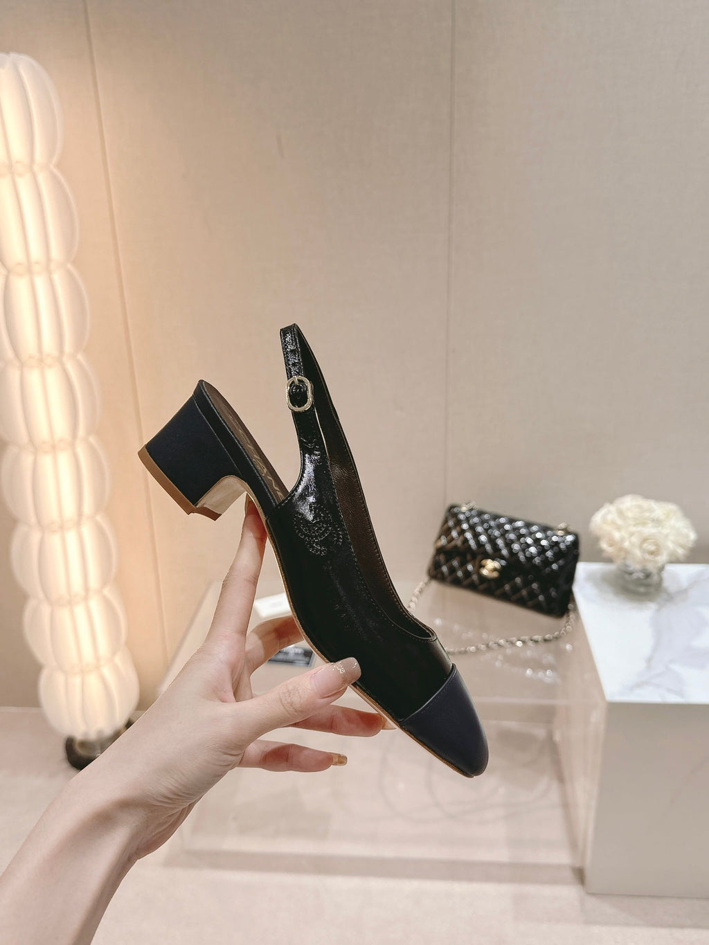 CHANEL SLINGBACKS IN BLACK SHEEPSKIN