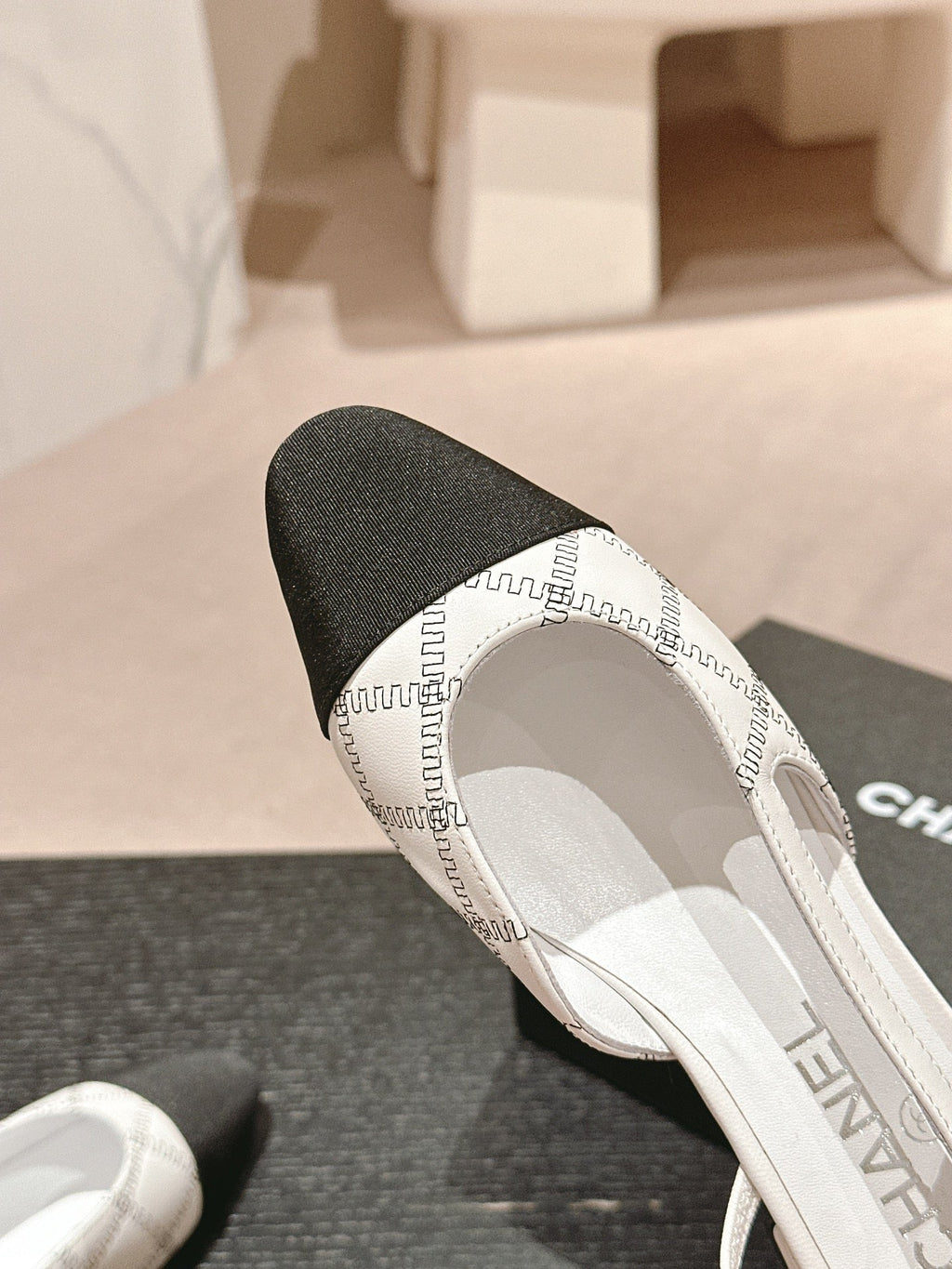 CHANEL SLINGBACKS IN WHITE LAMBSKIN AND BLACK SATIN