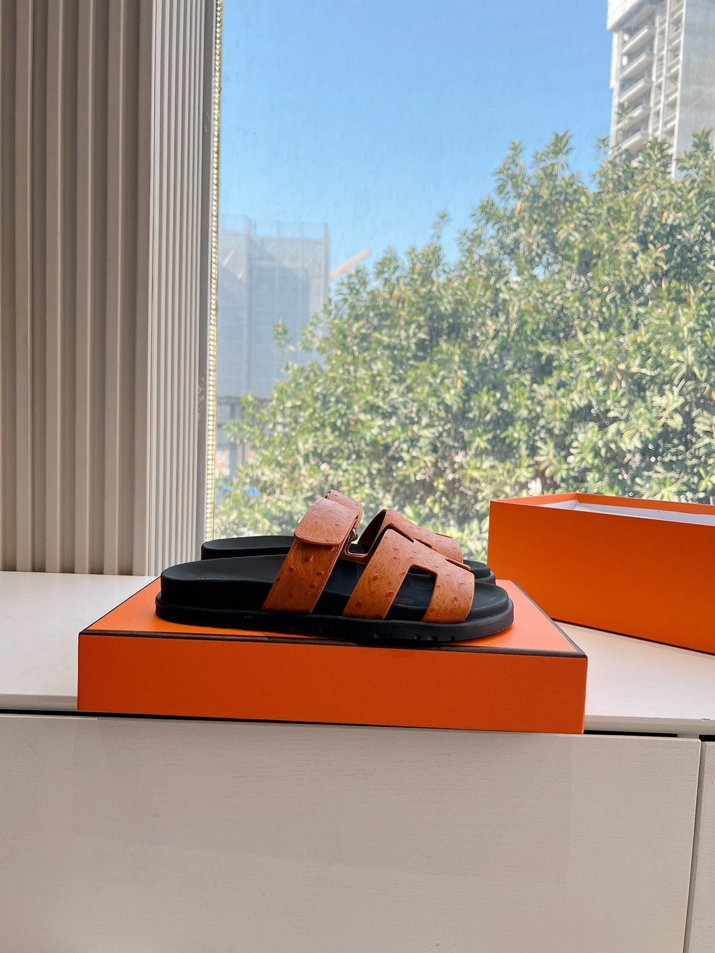 HERMES CHYPRE SANDAL IN VIVID ORANGE GRAINED CALFSKIN
