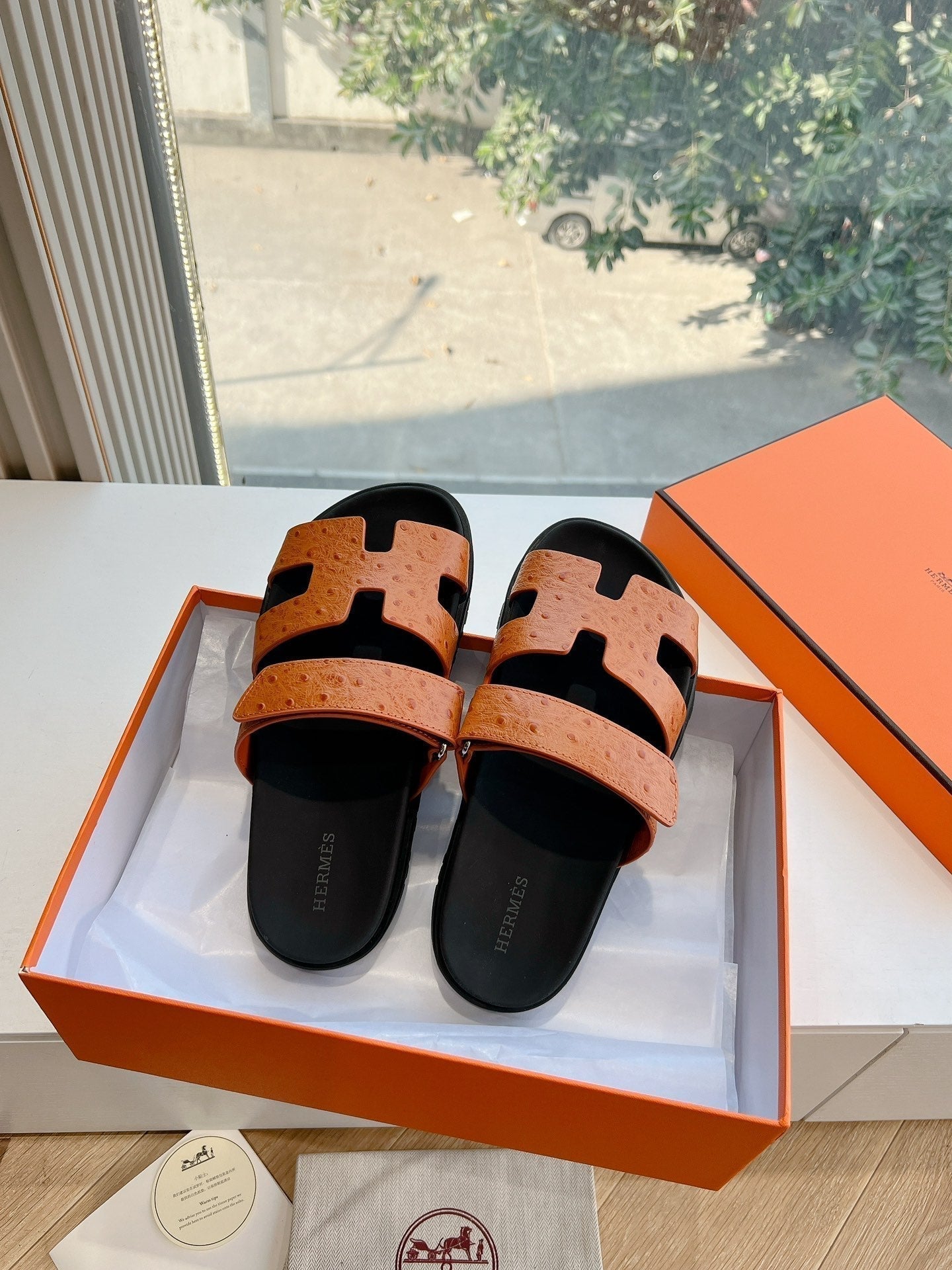 HERMES CHYPRE SANDAL IN VIVID ORANGE GRAINED CALFSKIN