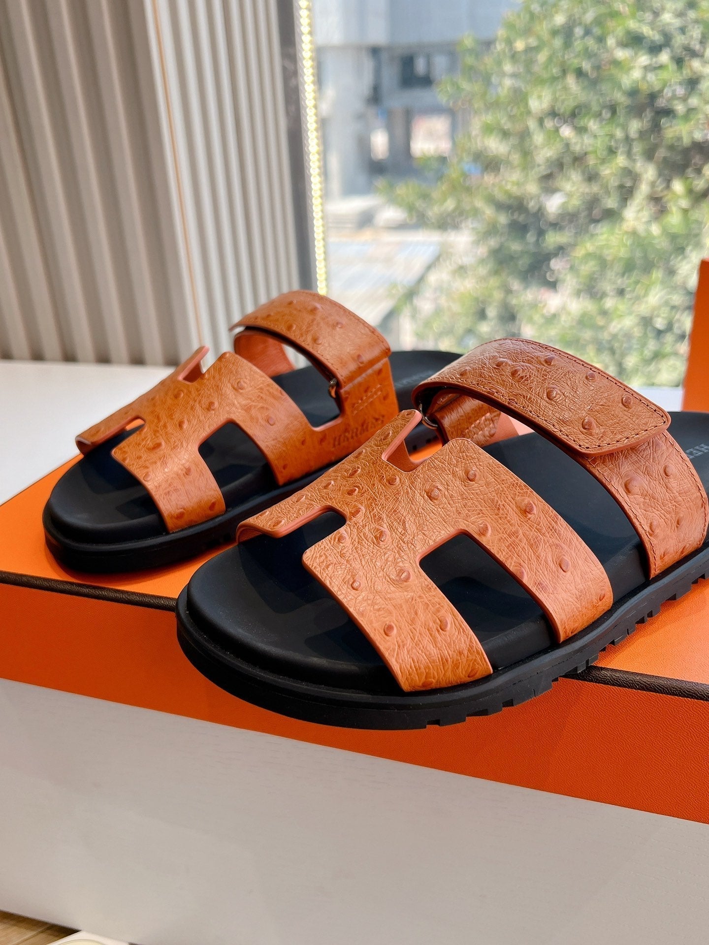 HERMES CHYPRE SANDAL IN VIVID ORANGE GRAINED CALFSKIN