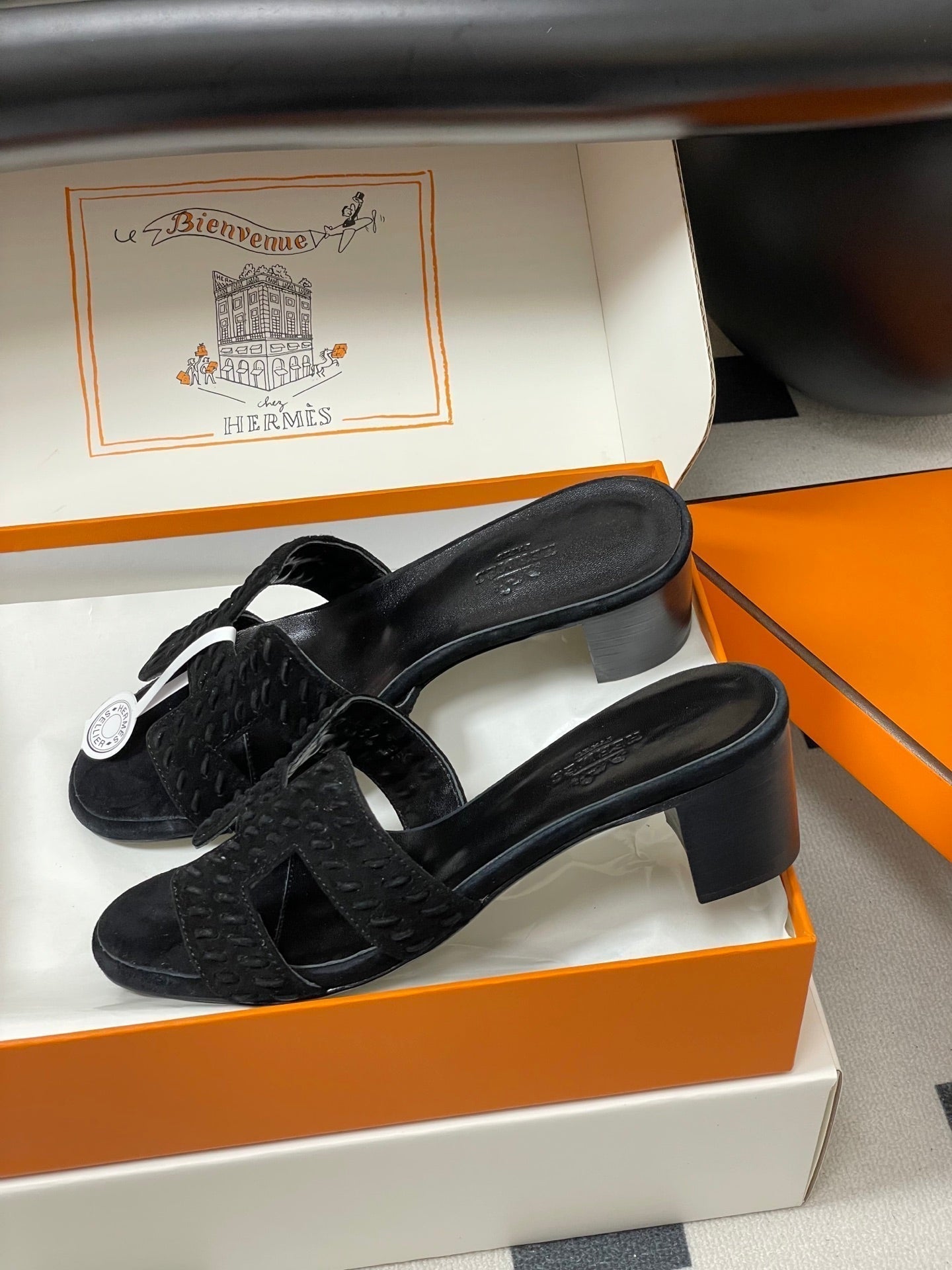 HERMES 25S ORAN HIGH‑HEEL SANDAL IN BLACK SUEDE AND LAMBSKIN