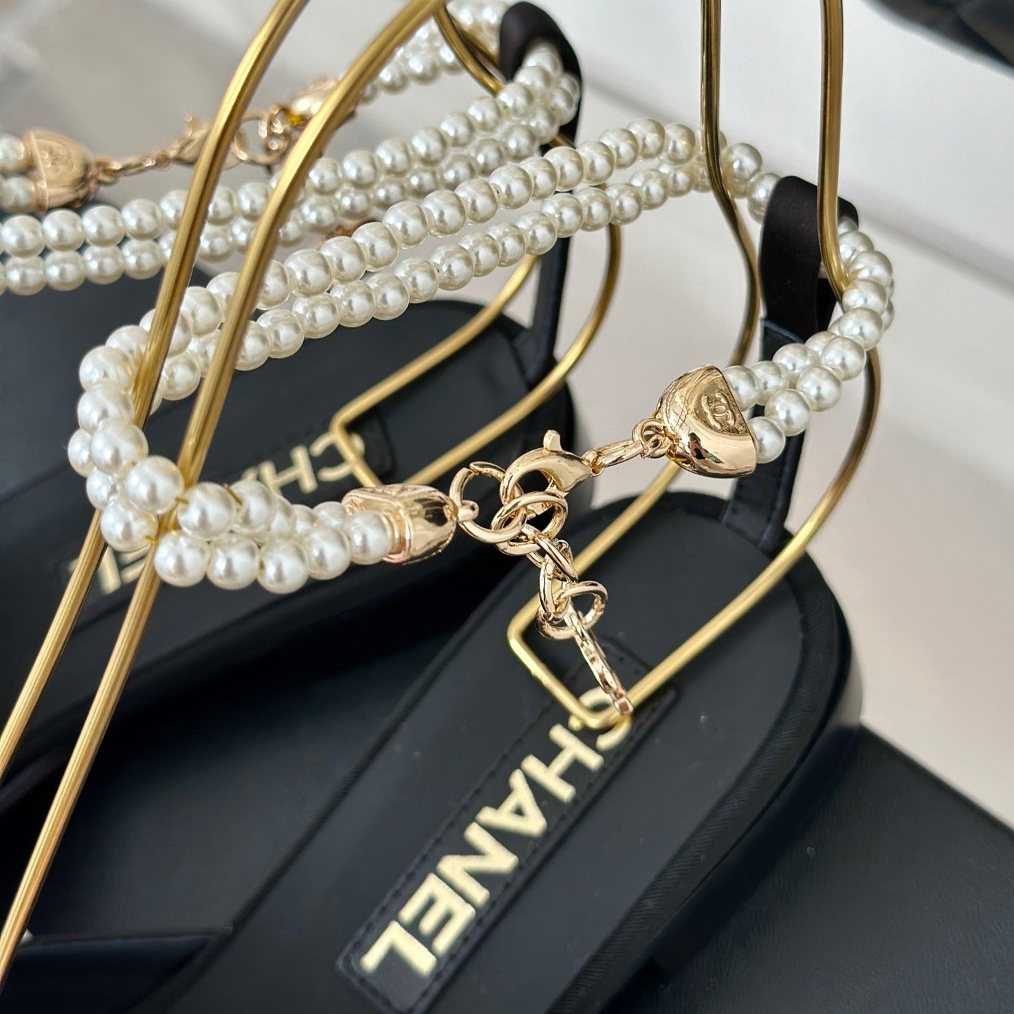 CHANEL Double C Big Bow Pearl Chain Sandals Light Pink Black Lambskin