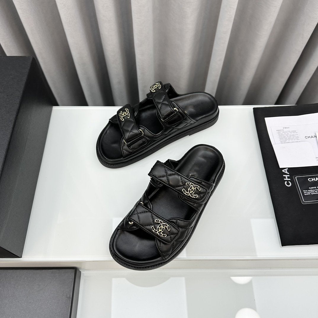 CHANEL dad sandals black lambskin mules